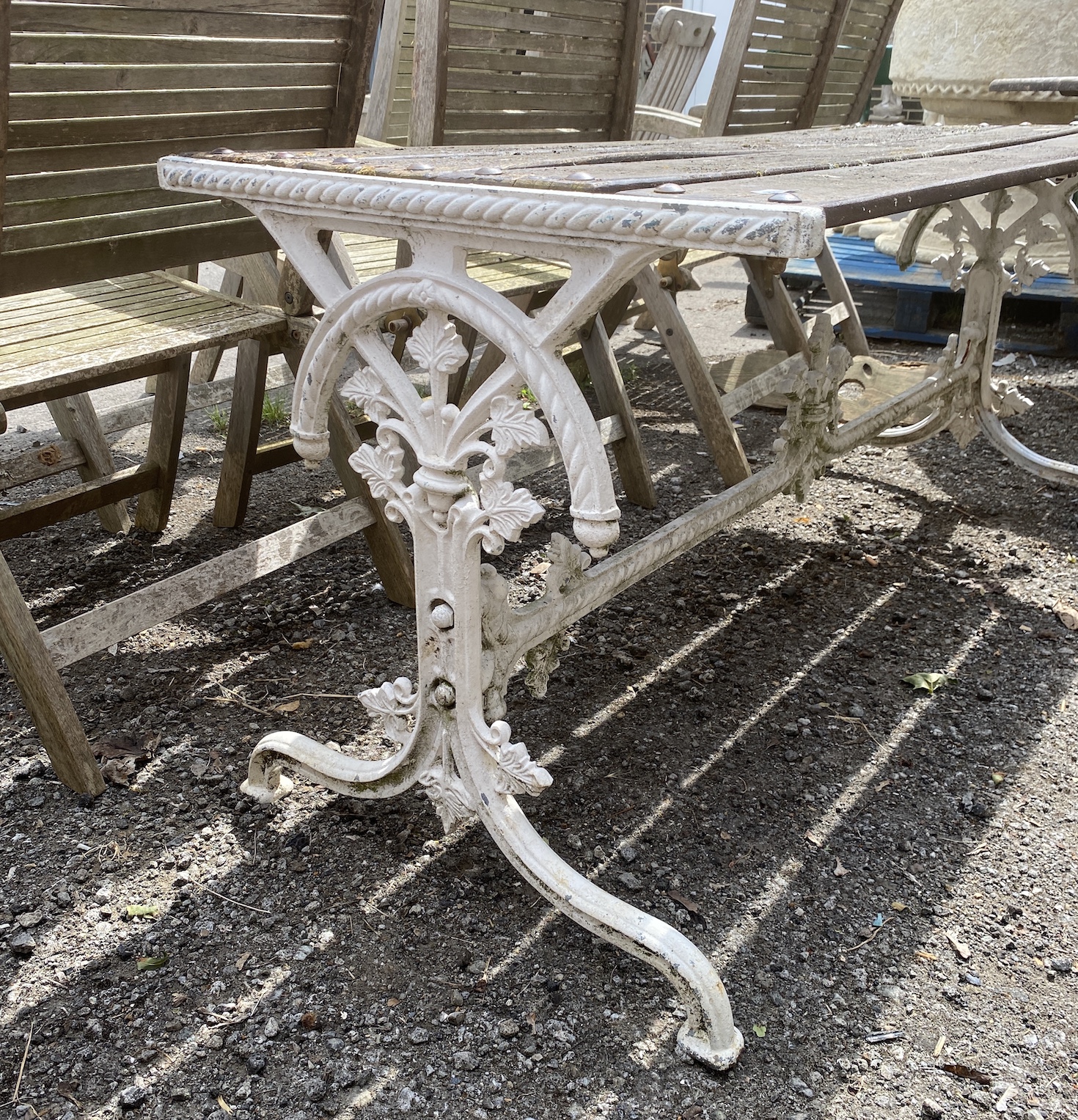 A Victorian style rectangular cast iron wooden topped stretcher table, length 155cm, depth 59cm, height 66cm